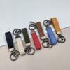 Fashionable Pebble Grain Hot Stamping Custom Logo Travel Accessories Car Leather Keychain with Zinc Alloy