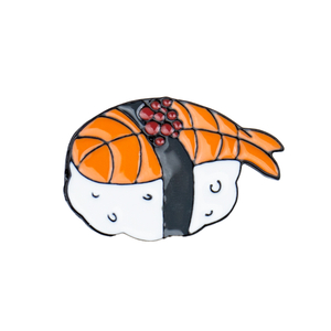 Cartoon sushi lapel pin with rice, seaweed, and fish filling on a white background.
